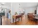 Bright, open-concept space with hardwood floors, seamlessly connecting to the kitchen at 6671 Chase St, Arvada, CO 80003