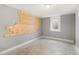 Unfinished room with a window and light fixture, ready for customization at 6671 Chase St, Arvada, CO 80003