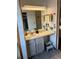 Well-lit bathroom features a vanity with ample counter space and built in step stool for easy access at 6836 W 84Th Cir # 15, Arvada, CO 80003