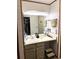 Clean bathroom with a vanity, ample storage, and good lighting at 6836 W 84Th Cir # 15, Arvada, CO 80003