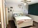 Cozy bedroom featuring a ceiling fan, decorative artwork, and a comfortable bed at 6836 W 84Th Cir # 15, Arvada, CO 80003