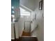 Bright entryway featuring a stylish light fixture and access to the upper level at 6836 W 84Th Cir # 15, Arvada, CO 80003