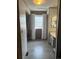 Hallway view featuring neutral colored walls and flooring, walk-in closet and an open bathroom at 6836 W 84Th Cir # 15, Arvada, CO 80003