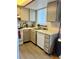 Functional kitchen features white appliances, ample counter space, and a practical layout at 6836 W 84Th Cir # 15, Arvada, CO 80003