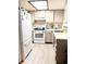 Functional kitchen with white appliances, ample counter space, and modern sink at 6836 W 84Th Cir # 15, Arvada, CO 80003
