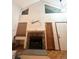 Bright living room with a stone fireplace, windows, and natural light at 6836 W 84Th Cir # 15, Arvada, CO 80003