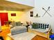 Comfortable living room with a gray sofa and loveseat, plus bright dining area at 6836 W 84Th Cir # 15, Arvada, CO 80003