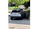 Assigned parking spot next to a grassy green area and beautiful trees at 6836 W 84Th Cir # 15, Arvada, CO 80003