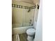 Modern bathroom with step-in shower featuring sliding glass doors and decorative green trim at 6836 W 84Th Cir # 15, Arvada, CO 80003