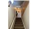 Carpeted stairs with white banister leading to the upper level at 6836 W 84Th Cir # 15, Arvada, CO 80003