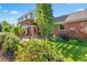 Landscaped backyard featuring a pergola over a patio area, perfect for outdoor entertaining at 3330 E Tennessee Ave, Denver, CO 80209
