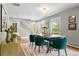 Bright dining room with hardwood floors, stylish furniture, and natural light at 3330 E Tennessee Ave, Denver, CO 80209