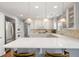 Kitchen boasts a large island with seating, stainless steel appliances, and plenty of cabinet space at 3330 E Tennessee Ave, Denver, CO 80209