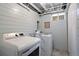 Practical laundry room with modern washer and dryer, offering convenience and efficiency at 3330 E Tennessee Ave, Denver, CO 80209