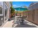 Outdoor patio perfect for entertaining, complete with a table, chairs, and stylish string lights at 3330 E Tennessee Ave, Denver, CO 80209