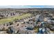 Aerial shot of a residential neighborhood, highlighting mature trees and proximity to golf course at 2059 June Ct, Castle Rock, CO 80104