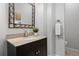 Stylish half-bathroom with granite counters and decorative mirror at 2059 June Ct, Castle Rock, CO 80104