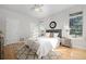 Bright bedroom featuring a ceiling fan, neutral decor, and large windows at 2059 June Ct, Castle Rock, CO 80104