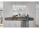 Kitchen area featuring granite counter tops, stainless steel appliances, and pass through to the living room at 2059 June Ct, Castle Rock, CO 80104