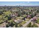 Expansive aerial shot showcasing the home nestled in a neighborhood with downtown and tree coverage at 5460 S Locust St, Greenwood Village, CO 80111
