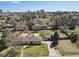 An aerial view capturing the home's placement within a lush, tree-filled neighborhood at 5460 S Locust St, Greenwood Village, CO 80111