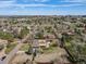 Overhead view highlighting property boundaries nestled in lush greenery, with city skyline in the distance at 5460 S Locust St, Greenwood Village, CO 80111