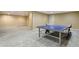 Finished basement featuring a ping pong table, neutral carpet, and recessed lighting at 5460 S Locust St, Greenwood Village, CO 80111
