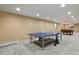 Finished basement featuring a ping pong table, pool table, and neutral carpet at 5460 S Locust St, Greenwood Village, CO 80111