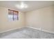 Bedroom features neutral carpet, baseboard heating, and a window with blinds at 5460 S Locust St, Greenwood Village, CO 80111