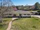 Charming exterior featuring a stone walkway, skylights, and a detached garage, enhancing curb appeal at 5460 S Locust St, Greenwood Village, CO 80111