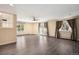 Open living room with neutral walls, ceiling fan, hardwood floors, and views of the exterior at 5460 S Locust St, Greenwood Village, CO 80111