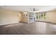 Open living room with neutral walls, ceiling fan, hardwood floors, and a modern fireplace at 5460 S Locust St, Greenwood Village, CO 80111
