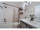 Bathroom with a bathtub, shower, neutral color palette, and modern vanity at 11785 W Belleview, Littleton, CO 80127