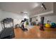 Bright home gym featuring wood floors and exercise equipment at 11785 W Belleview, Littleton, CO 80127