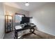 Home office space featuring a large desk, neutral carpet, and natural light from the window at 11785 W Belleview, Littleton, CO 80127