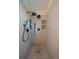 Modern shower room features dual shower heads and tiled walls with built-in shelving at 11785 W Belleview, Littleton, CO 80127