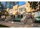 Image shows the front exterior of townhomes with flower beds, steps, and modern architectural design at 1644 Little Raven St, Denver, CO 80202