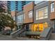 Stunning modern townhome featuring a unique facade and inviting entryways with beautiful city views at 1644 Little Raven St, Denver, CO 80202