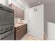 Functional laundry room with modern appliances and cabinet storage at 1644 Little Raven St, Denver, CO 80202