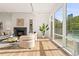 Spacious living room with fireplace, hardwood floors, and large windows offering ample natural light and city views at 1644 Little Raven St, Denver, CO 80202