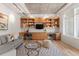 Living space with custom built-ins, modern furnishings, and a sleek, industrial ceiling at 1644 Little Raven St, Denver, CO 80202