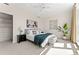Bright primary bedroom with art, ample natural light, and neutral decor, creating a serene and restful space at 1644 Little Raven St, Denver, CO 80202