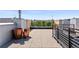 Image shows a beautiful rooftop patio with tile flooring, metal railings, and decorative flower pots at 1644 Little Raven St, Denver, CO 80202