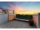Image shows patio with sunset views, tile flooring, and a large decorative flower pot at 1644 Little Raven St, Denver, CO 80202