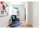 Cozy sitting area with a comfortable teal chair, modern art, and great city views at 1644 Little Raven St, Denver, CO 80202