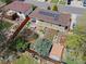 Aerial view of home with a beautifully landscaped backyard, picnic table, and solar panels at 1650 Bedivere Cir, Lafayette, CO 80026