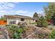 A backyard with a picnic table and well-maintained garden at 1650 Bedivere Cir, Lafayette, CO 80026