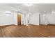 Expansive basement with light walls, wood floors and an open layout that is ready for customization at 1650 Bedivere Cir, Lafayette, CO 80026