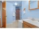 This bathroom features a single sink, a walk-in shower, and light blue walls at 1650 Bedivere Cir, Lafayette, CO 80026