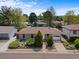 Charming home featuring well-maintained landscaping, a one-car garage, and a beautiful garden at 1650 Bedivere Cir, Lafayette, CO 80026
